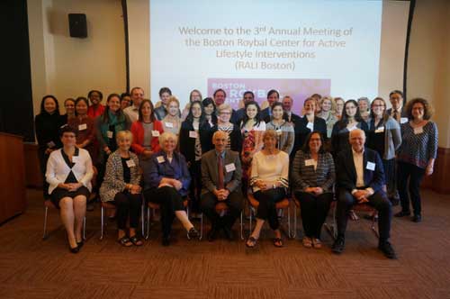 Group of meeting attendees smiling